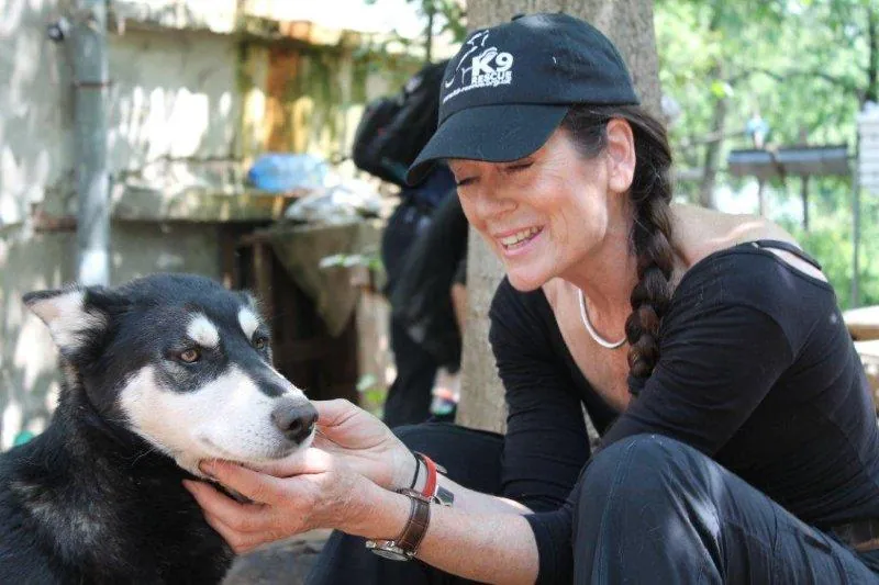 K9 Rescue patron Lorraine Chase with a rescued dog in Bulgaria